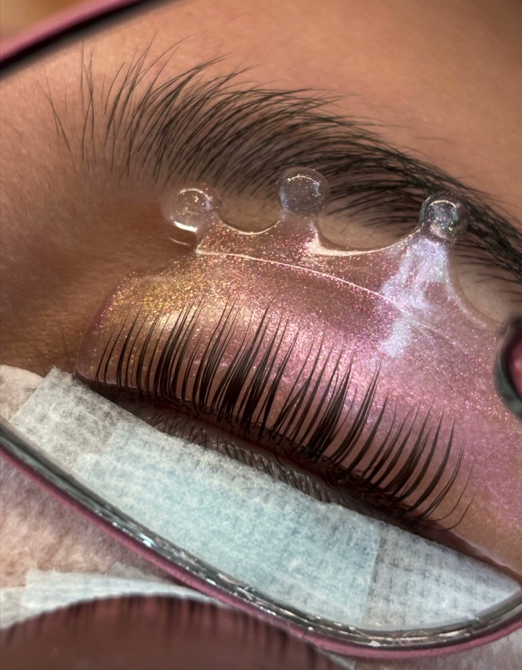 Korean lash lift in progress, lashes lifted on a crown shield